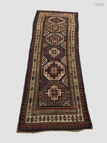 A KAZAK RUNNER, Central Caucasus, c.1880, the indigo field w...