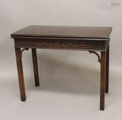 A GEORGE III MAHOGANY CARD TABLE. With a rectangular fold to...