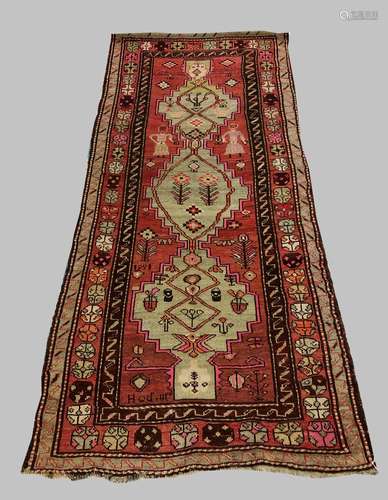 AN ARMENIAN KARABAGH RUG, the salmon field with a column of ...