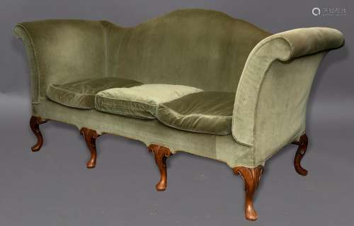 A QUEEN ANNE STYLE THREE SEATER SETTEE. The settee upholster...