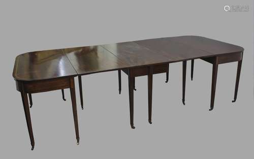 A GEORGE III MAHOGANY EXTENDING DINING TABLE, of rounded rec...