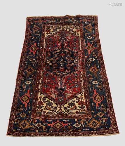 A HAMADAN RUG, Iranian Kurdistan, the madder field centred b...