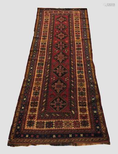 A KARABAGH LONG RUG, the raspberry field with columns of ste...