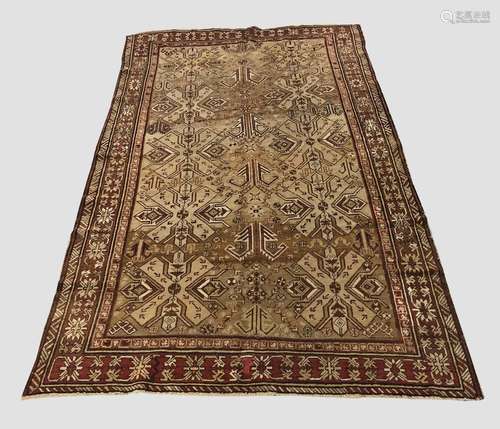 AN EAST CAUCASIAN RUG, c.1910, the abrashed camel ground wit...