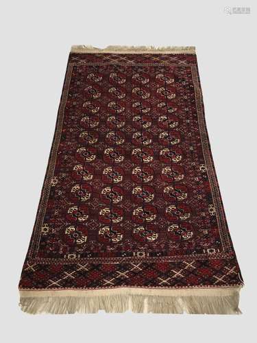 A TEKKE TURKMEN RUG, c.1900, Emirate of Bukhara, the maroon ...