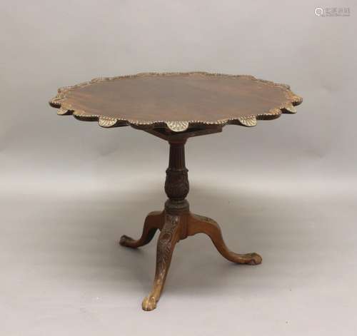 A CHIPPENDALE STYLE MAHOGANY TRIPOD TABLE, the 'pie crust' t...