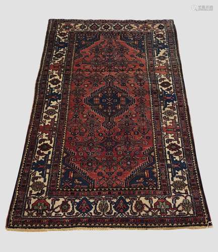 A HAMADAN RUG, Iranian Kurdistan, c.1930, the madder Herati ...