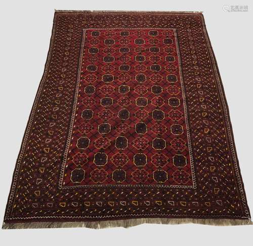 AN ERSARI CARPET, mid 20th century, the deep brick red diamo...