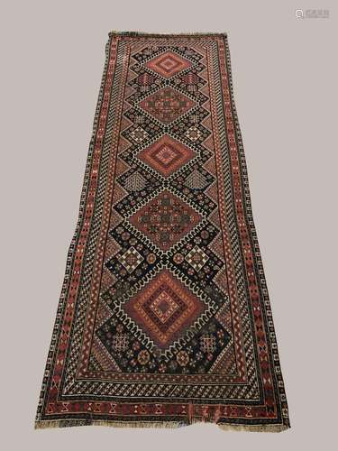 A KASHGAI RUNNER, South West Iran, c.1900, the midnight blue...