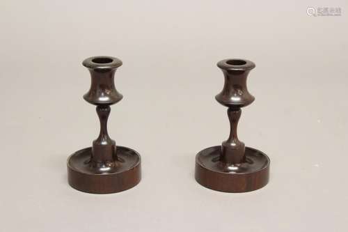 A PAIR OF VICTORIAN TURNED CANDLESTICKS. A finely turned pai...