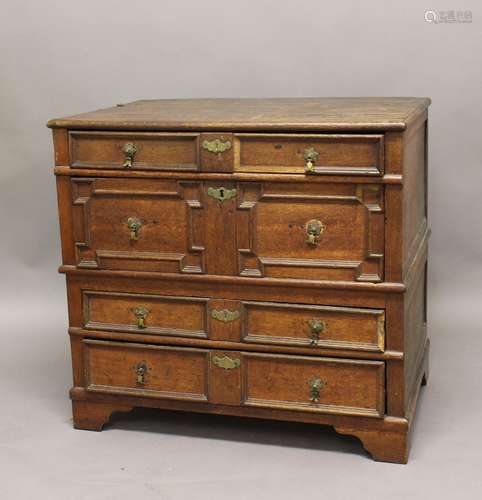 AN OAK CHEST OF DRAWERS, late 17th/early 18th century, with ...