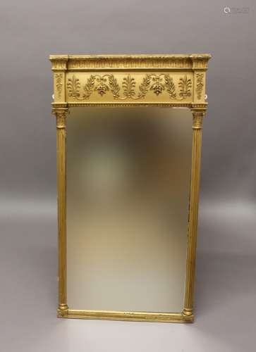 A REGENCY GILTWOOD PIER MIRROR. A rectangular mirror between...