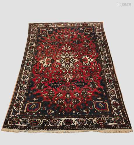 A BAKHTIARI CARPET, West Iran, c.1930, the strawberry field ...