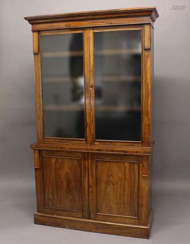 A 19TH CENTURY ROSEWOOD BOOKCASE, the glazed top with three ...