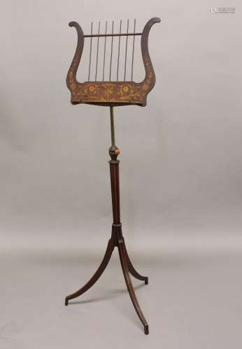 AN EDWARDIAN INLAID MAHOGANY ADJUSTABLE MUSIC STAND. The lyr...