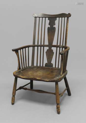 AN ASH AND ELM WINDSOR CHAIR, 19th century, the wavy top rai...