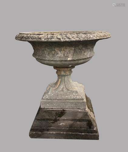 A LARGE COMPOSITION 'EASTWELL' URN ON PEDESTAL. With a broad...