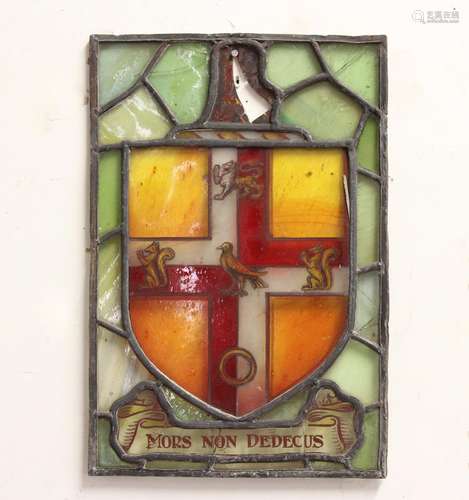 A STAINED GLASS ARMORIAL PANEL, with a shield shaped armoria...