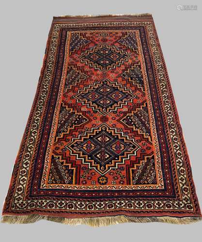 AN AFSHAR RUG, c.1910, South East Iran, the pale brick red f...