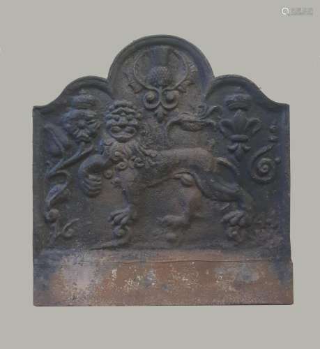 A CAST IRON FIREBACK DATED 1644. A fire back with arched top...