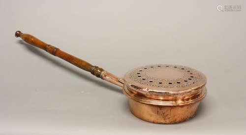 A COPPER WARMING OR 'PLAGUE' PAN. A copper bodied warming pa...