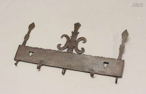 AN 18th CENTURY WROUGHT IRON UTENSIL RACK. A wrought iron ha...