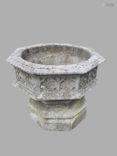 A LARGE GOTHIC REVIVAL COMPOSITION STONE GARDEN URN. With a ...