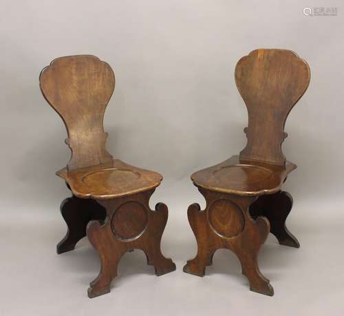 A PAIR OF 18TH CENTURY DUTCH HALL CHAIRS. A pair of mahogany...