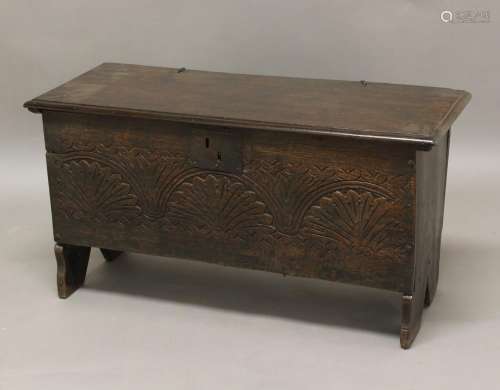 A 17TH CENTURY OAK PLANK COFFER, the front with arched and f...