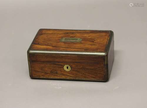 A REGENCY ROSEWOOD DRESSING TABLE BOX, brass bound, the fitt...