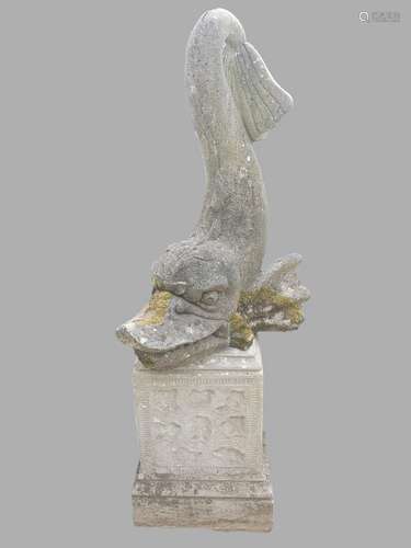 A COMPOSITION STONE FOUNTAIN WITH DOLPHIN SCULPTURE. An elab...