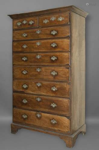 A GEORGE III OAK TALL CHEST OF DRAWERS. The chest with two s...