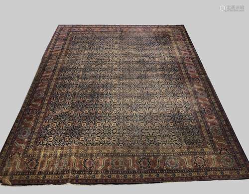 AN ISPARTA CARPET, Central West Anatolia, c.1920, the deep i...