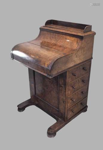 A VICTORIAN BURR WALNUT PIANO FRONTED DAVENPORT. The sliding...