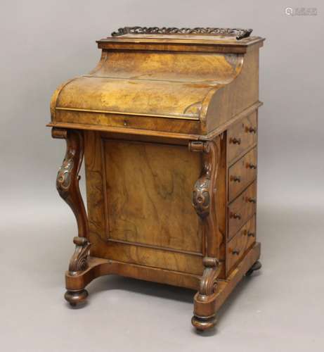 A VICTORIAN BURR WALNUT PIANO FRONTED DAVENPORT. The Davenpo...