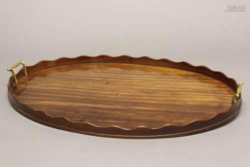 A LARGE 19TH CENTURY OVAL MAHOGANY TEA TRAY. The broad tray ...