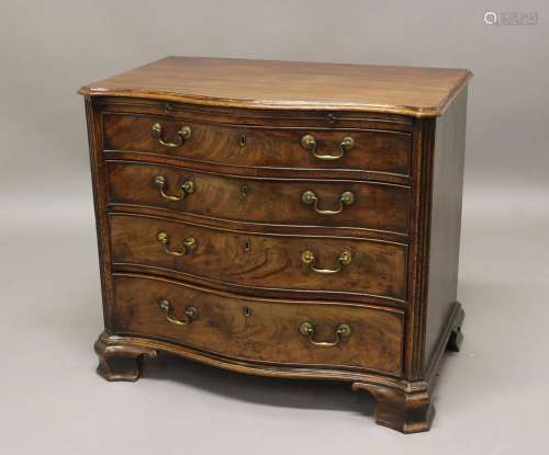 A GEORGE III MAHOGANY SERPENTINE FRONTED DRESSING CHEST, the...