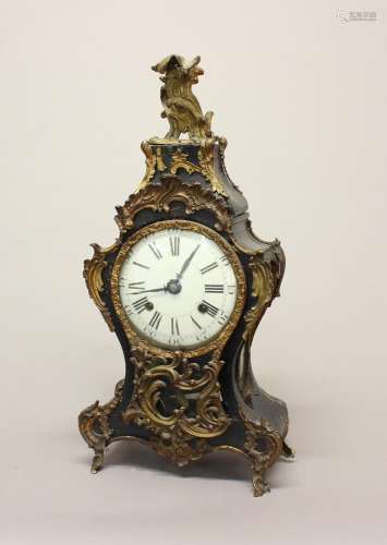 A LOUIS XV ORMOLU MOUNTED MANTLE CLOCK. An elaborate Louis X...