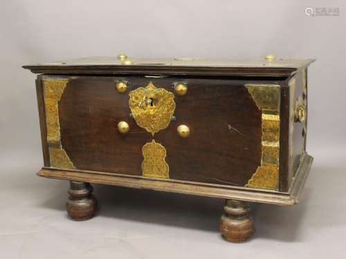 A LARGE 19TH CENTURY CEYLONESE TRUNK ON STAND. The broad rec...