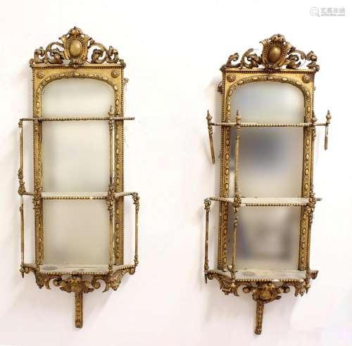 A PAIR OF VICTORIAN CARVED GILT WALL SHELVES. A pair of Vict...