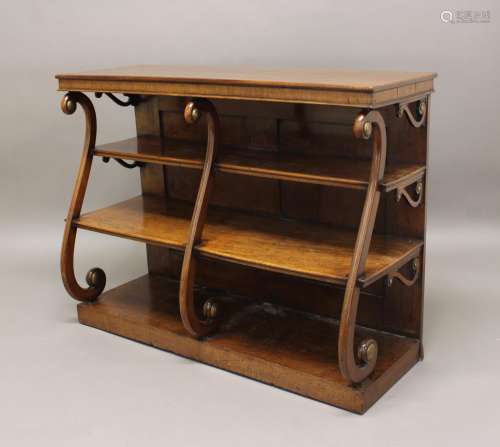 A REGENCY MAHOGANY WATERFALL BOOKCASE. With a rectangular to...