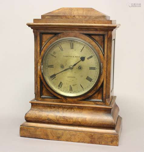 A VICTORIAN WALNUT CASED BRACKET CLOCK BY THWAITES AND REED....