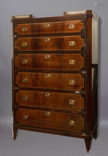 A LOUIS XVI STYLE TALL CHEST OF DRAWERS. The mahogany veneer...