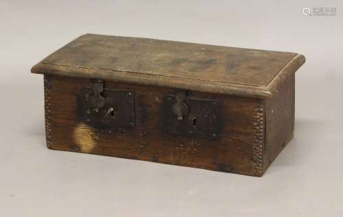 A 17TH CENTURY OAK LOCKBOX, with twin iron locks and chip ca...