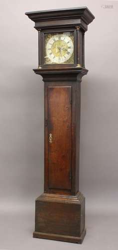 AN OAK CASED 30 HOUR LONGCASE CLOCK BY HOW. With an 11