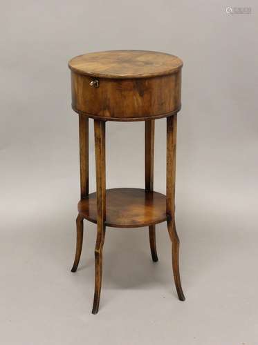 A 19TH CENTURY YEW WOOD SEWING TABLE, the circular lift-up t...