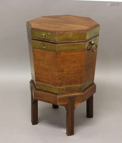 A GEORGE III BRASS BOUND MAHOGANY WINE COOLER ON STAND, of o...