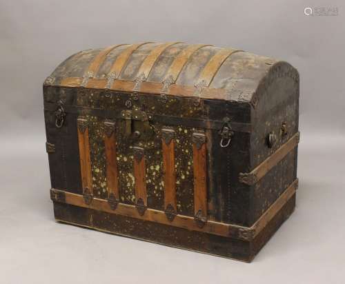 AN IRON BOUND DOME-TOPPED TRUNK, with original, fitted inter...