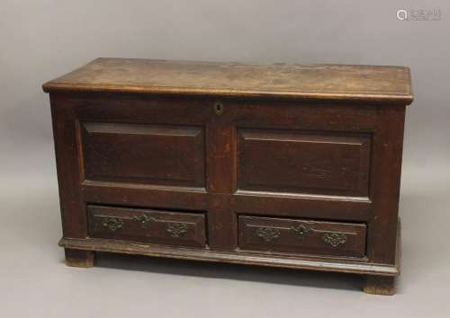 A GEORGE II OAK MULE CHEST. With a hinged rectangular lid wi...