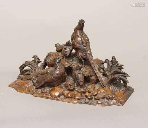 A VICTORIAN CARVED WALNUT SCULPTURE OF GAME BIRDS. A finely ...